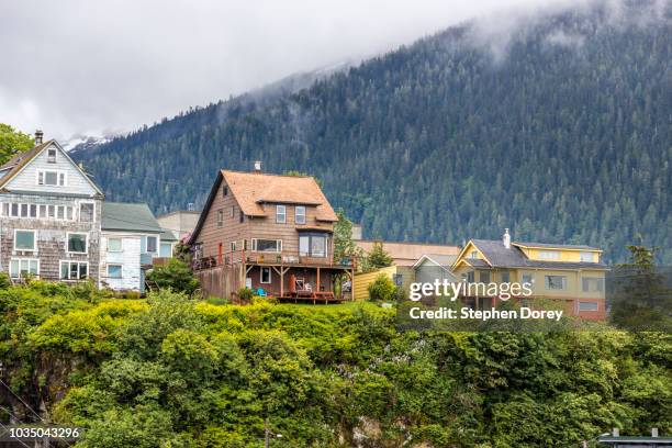 domestic properties above the harbour at ketchikan, alaska usa - viewed from a cruise ship sailing the inside passage - houses of alaska stock pictures, royalty-free photos & images