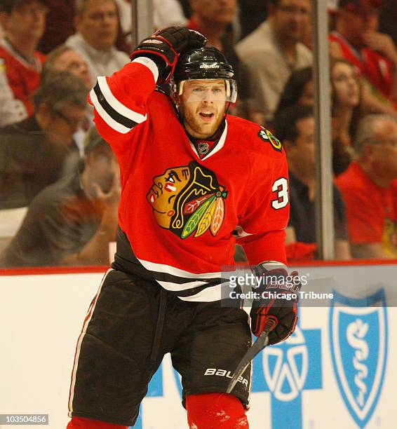 Chicago Blackhawks' Kris Versteeg reacts after being called on a penalty against the Vancouver Canucks during the first period in Game 2 of the NHL...