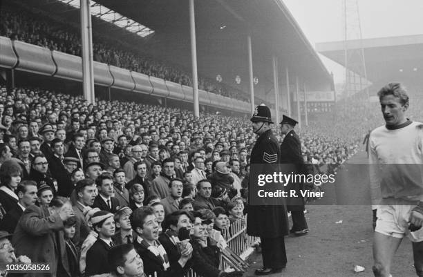 Scottish soccer player Denis Law of Manchester United FC being sent off the field during a match against Aston Villa FC, Villa Park Stadium,...