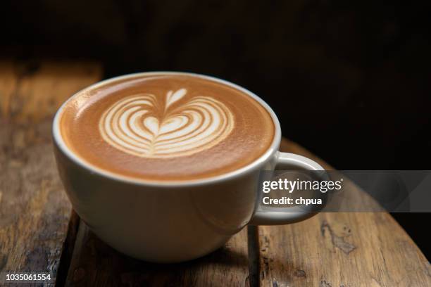 a cup of latte on wooden table - coffee foam imagens e fotografias de stock