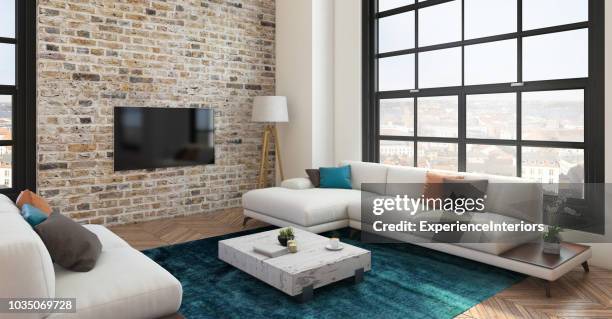 loft-wohnung-wohnzimmer mit großbild-tv led - table brick wall wood stock-fotos und bilder