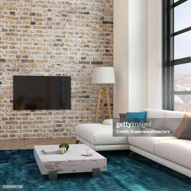 loft-wohnung-wohnzimmer mit großbild-tv led - table brick wall wood stock-fotos und bilder