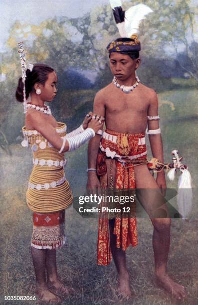 Photograph of Two Young Ibans. Ibans are a branch of the Dayak peoples of Borneo. Dated 1920.