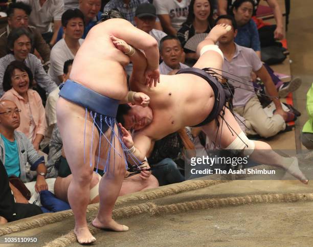 Shodai throws Myogiryu to win on day nine of the Grand Sumo Autumn Tournament at Ryogoku Kokugikan on September 17, 2018 in Tokyo, Japan.