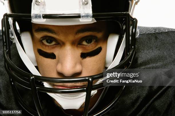 african american man wearing football uniform - safety american football player stock pictures, royalty-free photos & images