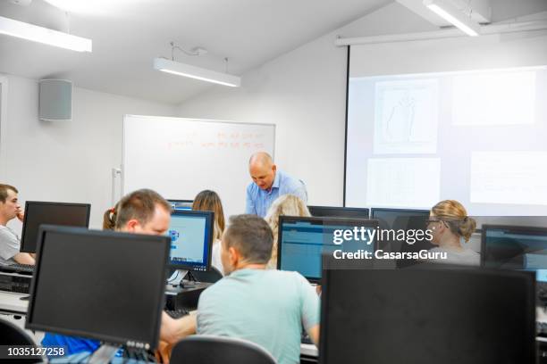 Adult Computer Class Images Adult Students In Having Class Computer Classroom High-Res Stock Photo ...