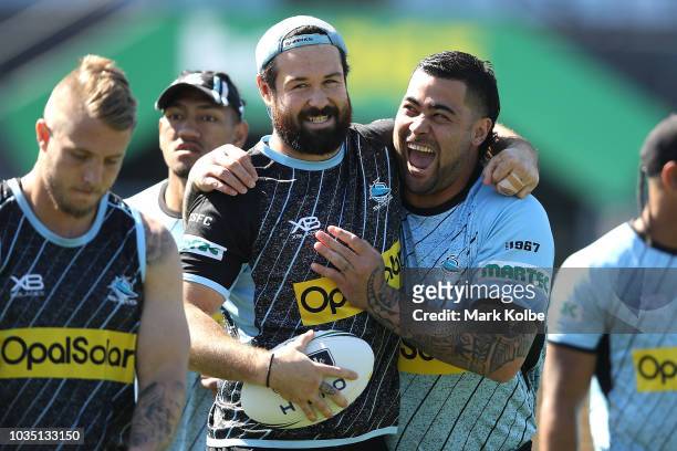 Aaron Woods and Andrew Fifita laugh during a Cronulla Sharks NRL training session at Southern Cross Group Stadium on September 18, 2018 in Sydney,...