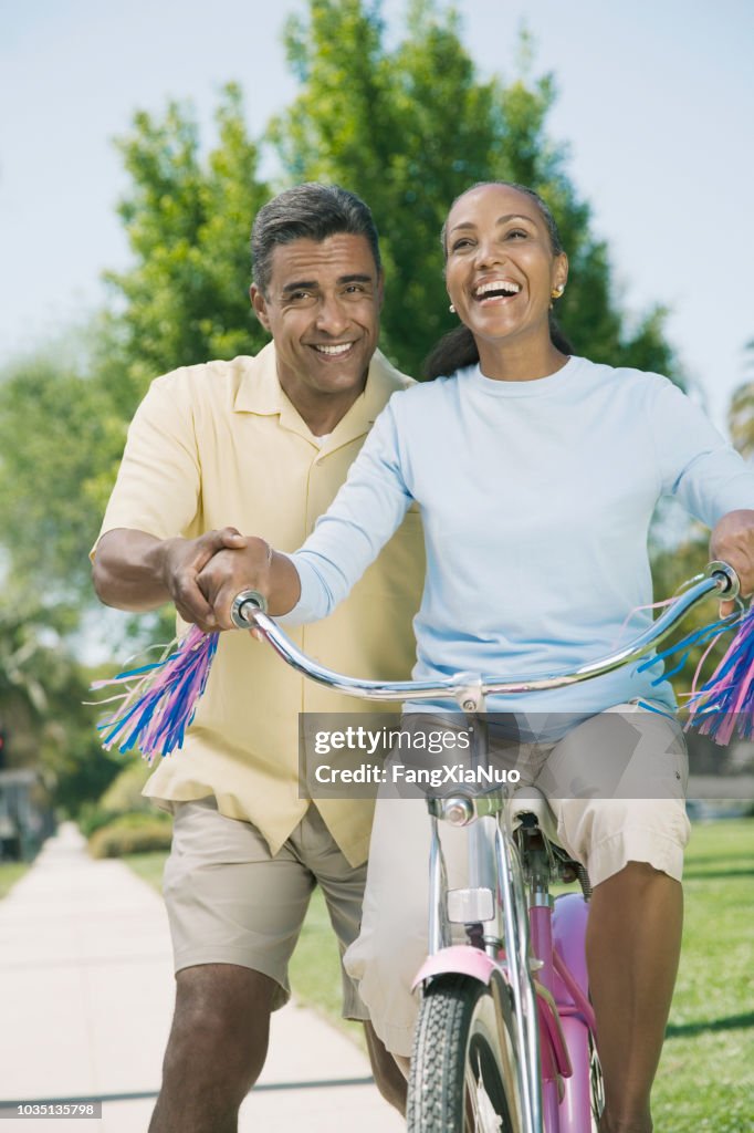 Mixed Riding Mixed Race Woman Riding Girls Bicycle High-Res Stock Photo - Getty Images