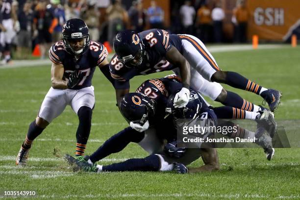 Prince Amukamara of the Chicago Bears tackles Brandon Marshall of the Seattle Seahawks in the first half at Soldier Field on September 17, 2018 in...