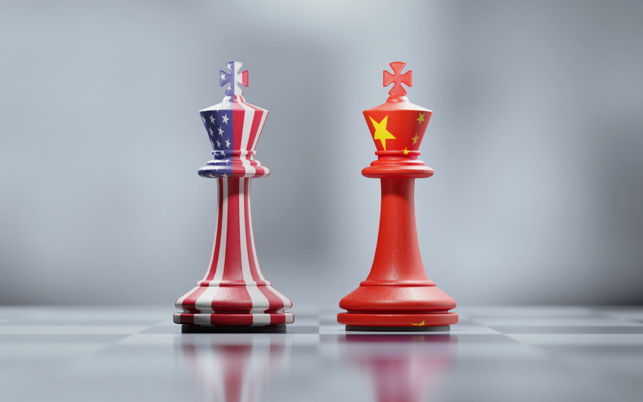 Two King Chess Pieces Textured With American And Chinese Flags On Black And White Chessboard Two King Chess Pieces Textured With American And Chinese Flags On Black And White Chessboard