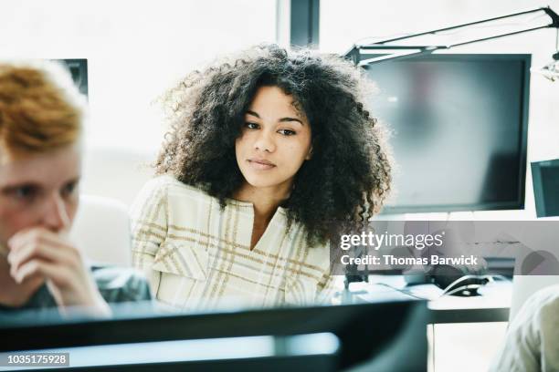 portrait of female engineer working in computer lab - 20s talking serious bildbanksfoton och bilder
