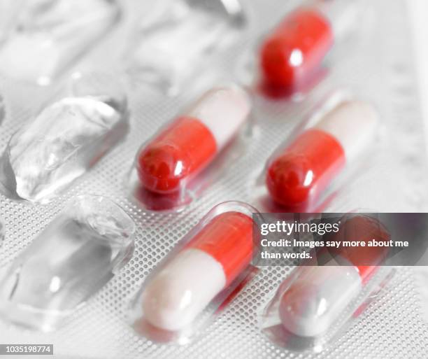 a close up of a half empty pill pack. - blister package stock pictures, royalty-free photos & images