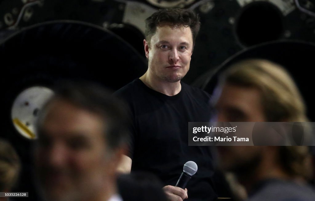 SpaceX CEO Elon Musk listens to a question at a press conference
