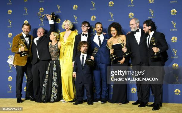 The cast of Game of Thrones pose with the Emmy for Outstanding Drama Series during the 70th Emmy Awards at the Microsoft Theatre in Los Angeles,...