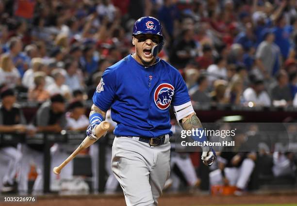 Javier Baez of the Chicago Cubs reacts after hitting a two run home run during the sixth inning against the Arizona Diamondbacks at Chase Field on...