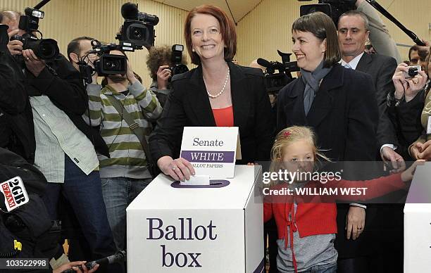 Australia's Prime Minister Julia Gillard votes with Minister of Health, Nicola Roxon , votes in the national election at a polling station in...