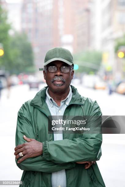 black man on urban street - new york state government stock pictures, royalty-free photos & images