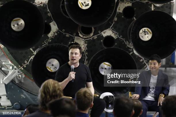 Elon Musk, chief executive officer for Space Exploration Technologies Corp. , left, speaks as Yusaku Maezawa, founder and president of Start Today...