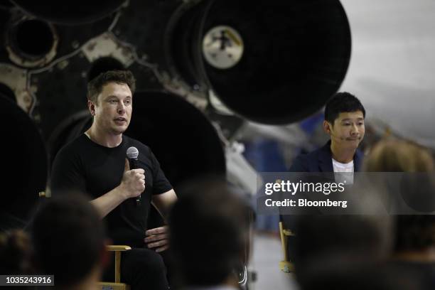 Elon Musk, chief executive officer for Space Exploration Technologies Corp. , left, speaks as Yusaku Maezawa, founder and president of Start Today...