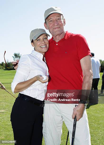 Actress Sonja Kirchberger and Michael Mendl attend the BMW Adlon Golf Cup 2010 at Golf and Country Club Seddiner See on August 21, 2010 in Michendorf...