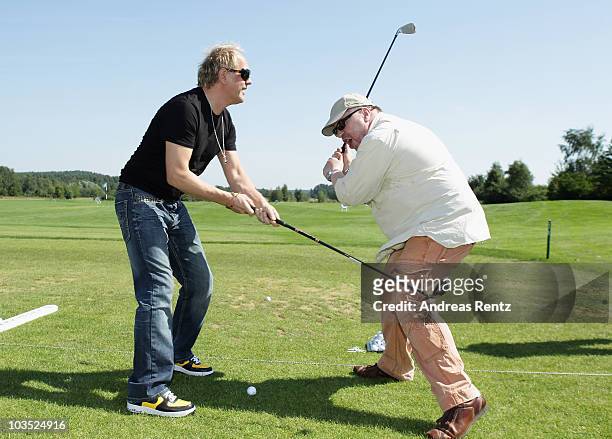 Actors Uwe Ochsenknecht and Armin Rohde attend the BMW Adlon Golf Cup 2010 at Golf and Country Club Seddiner See on August 21, 2010 in Michendorf...