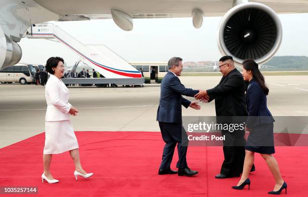 South Korean President Moon Jae-in and his wife Kim Jung-sook are welcomed by North Korean leader Kim Jong Un and his wife Ri Sol Ju upon their...