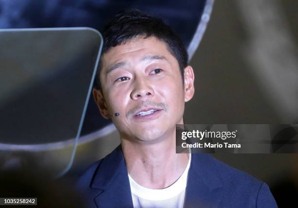 Yusaka Maezawa, the Japanese billionaire chosen by SpaceX CEO Elon Musk to fly around the moon, listens to a question at SpaceX headquarters on...