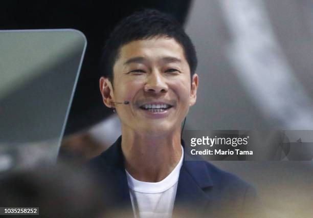 Yusaka Maezawa, the Japanese billionaire chosen by SpaceX CEO Elon Musk to fly around the moon, smiles at SpaceX headquarters on September 17, 2018...