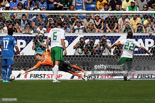 Torsten Frings of Bremen scores his team's first goal with a penalty against goalkeeper Tom Starke of Hoffenheim during the Bundesliga match between...