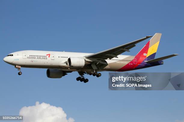 An Asiana Airlines Boeing 777-200ER landing at Rome Fiumicino airport.