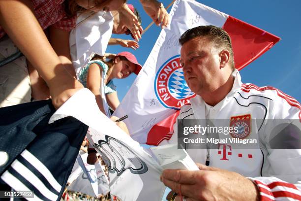 Head coach Louis van Gaal of Bayern signs autographs during a promotional event at the Audi factory on August 21, 2010 in Ingolstadt, Germany....