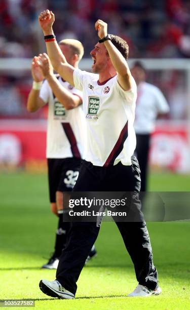 Head coach Marco Kurz of Kaiserslautern celebrates after winning the Bundesliga match between 1. FC Koeln and 1. FC Kaiserslautern at...