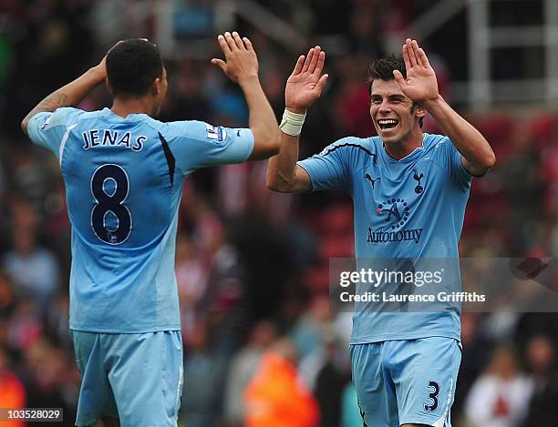 Gareth Bale of Tottenham celebrates with Jermaine Jenas during the Barclays Premier League match between Stoke City and Tottenham Hotspur at the...