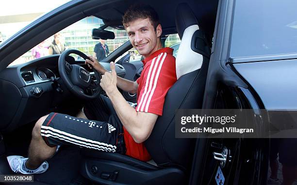 Thomas Mueller of Bayern poses inside a car during a promotional event at the Audi factory on August 21, 2010 in Ingolstadt, Germany. Luxury-car...