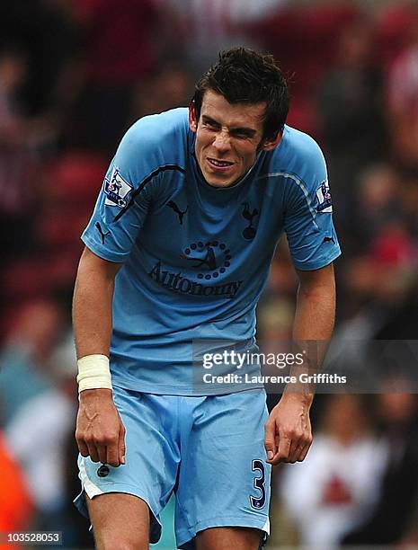 Gareth Bale of Tottenham shows his relief on the final whistle during the Barclays Premier League match between Stoke City and Tottenham Hotspur at...