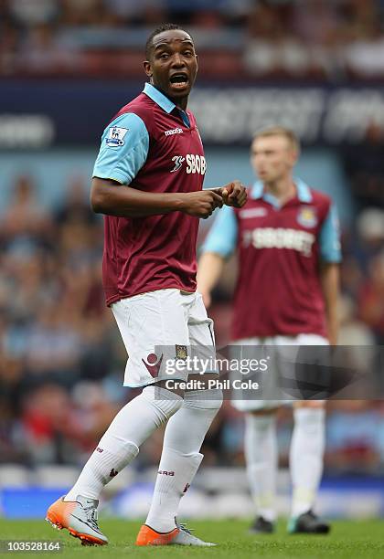 Benni McCarthy of West Ham Unitedspeaks to team mates during the Barclays Premier League match between West Ham United and Bolton Wanderers at the...