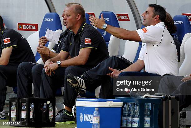 Head coach Thomas Schaaf and manager Klaus Allofs react during the Bundesliga match between 1899 Hoffenheim and Werder Bremen at the Rhein-Neckar...