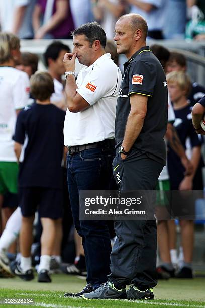 Head coach Thomas Schaaf and manager Klaus Allofs stand at the sideline after the Bundesliga match between 1899 Hoffenheim and Werder Bremen at the...