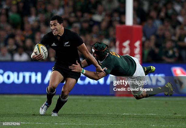 Mils Muliaina of the All Blacks moves away from Victor Matfield during the 2010 Tri-Nations match between the South African Springboks and the New...