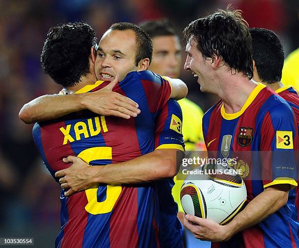 Barcelona's midfielder Andres Iniesta , Barcelona's midfielder Xavi Hernandez and Barcelona's Argentinian forward Lionel Messi celebrate after...