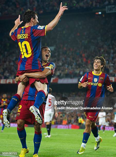 Daniel Alves of FC Barcelona celebrate with his teammate Lionel Messi during the Supercopa, second leg, match between Barcelona and Sevilla at the...