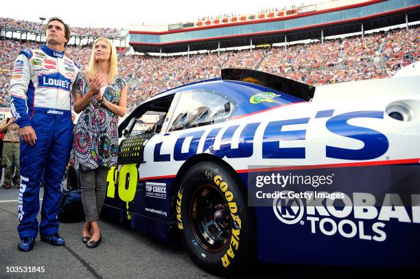 Jimmie Johnson , driver of the Lowe's Chevrolet, stands with his wife Chandra on the grid prior to the start of the NASCAR Sprint Cup Series IRWIN...