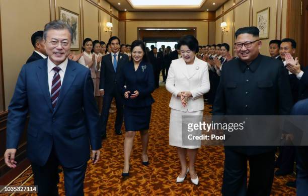 North Korean leader Kim Jong Un guides South Korean President Moon Jae-in and his wife Kim Jung-sook as they arrive at Paekhwawon State Guesthouse...