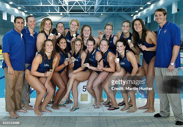 Team mates pose with their Gold Medals after winning the final match between Australia and the United States of America on day six of the 2010 FINA...