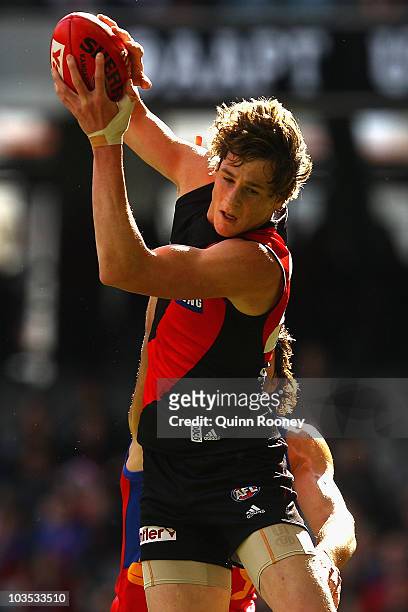 Jake Carlisle of the Bombers marks during the round 21 AFL match between the Essendon Bombers and the Brisbane Lions at Etihad Stadium on August 22,...