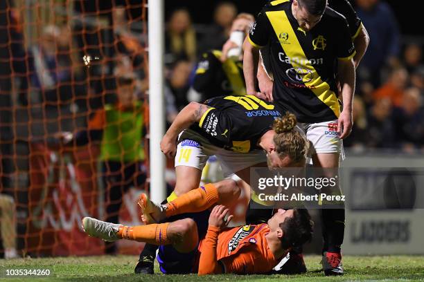 Harry Noon of Heidelberg United clashes with Marek Madle of Lions FC during the NPL Semi Final match between Lions FC and Heidelberg United at Lions...