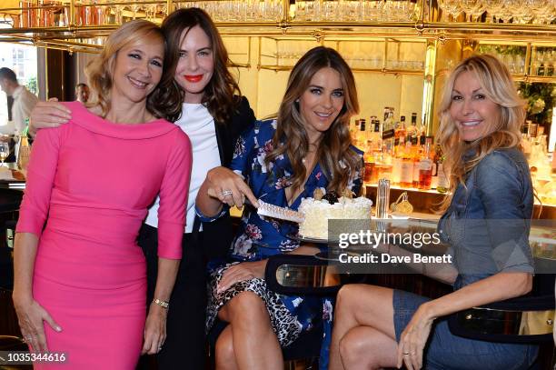 Tania Bryer, Trinny Woodall, Elizabeth Hurley and Melissa Odabash attend the World's Biggest Coffee Morning hosted by Elizabeth Hurley in support of...