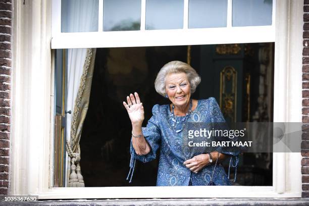 Dutch Princess Beatrix waves from Cabinet of the King during the 'Prinsjesdag' in The Hague, on September 18, 2018. Prince's Day is the traditional...