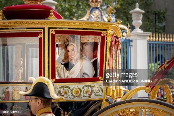 Queen Maxima waves from the Glass Carriage after departure from the Palace Noordeinde during 'Prinsjesdag' in The Hague, on September 18, 2018....