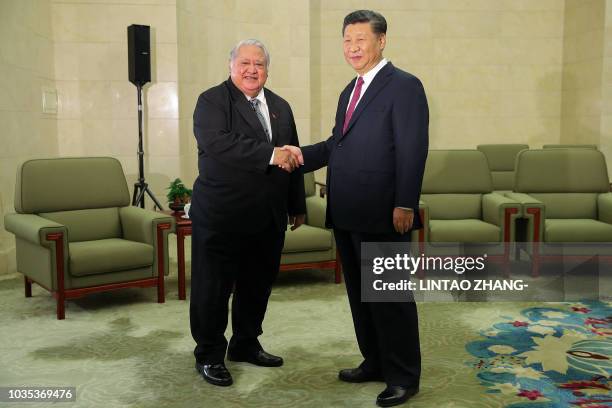 Samoa's Prime Minister Tuilaepa Sailele Malielegaoi meets Chinese President Xi Jinping at the Great Hall Of The People in Beijing on September 18,...